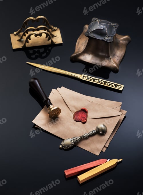 Preview: Old envelope with red wax seal and a vintage writing set