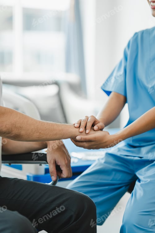 Preview: doctor holding patient's hand Cheer and encourage while checking your health. Trust your health and