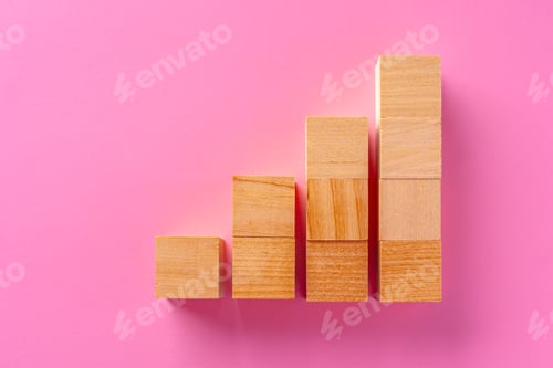 Preview: Top view of toy wooden blocks on pink