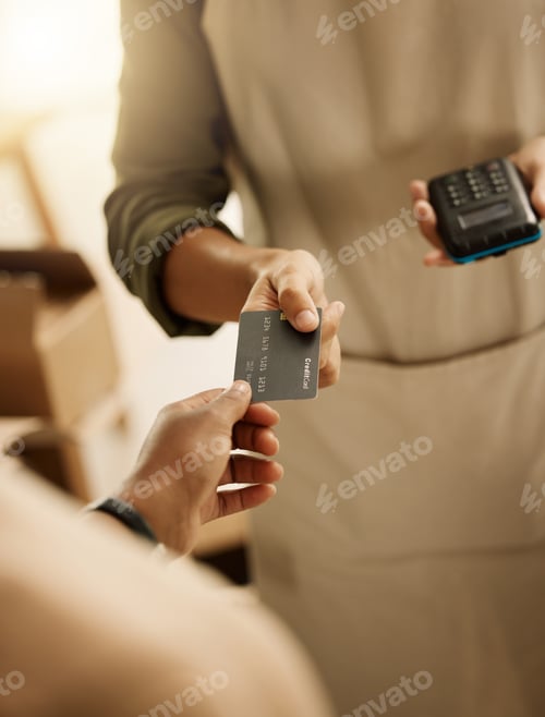 Preview: Closeup of customer paying bill with credit card. Businessman using contactless card machine for cu