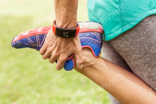 Preview: Mature woman, holding foot, stretching, mid section