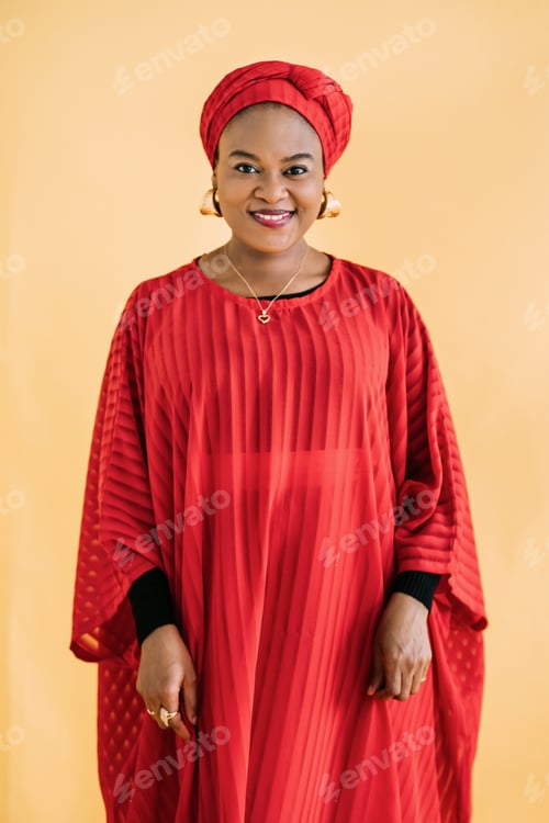 Preview: Women in traditional African style. Waist up studio shot of beautiful African woman in red dress