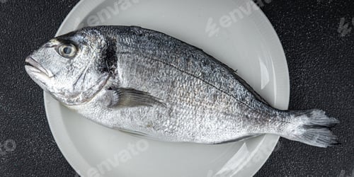 Preview: raw fish sea bream seafood fresh cooking snack appetizer meal food on the table copy space food