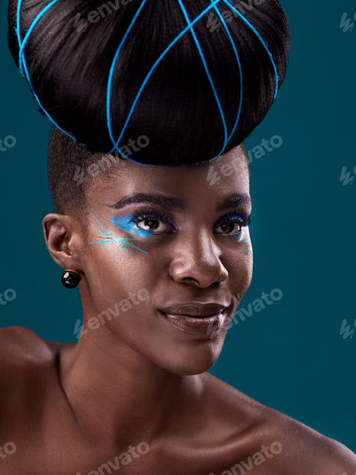 Preview: Studio shot of a beautiful young woman posing against a dark background