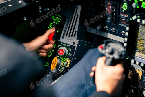 Preview: cockpit of a military plane a pilot with a steering wheel and many buttons on the control panel