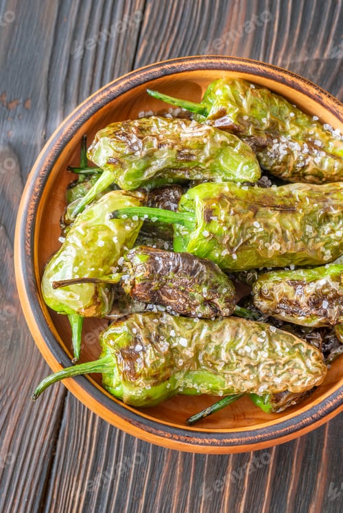 Preview: Terracotta bowl of Pimientos de Padron sprinkled with coarse sea salt