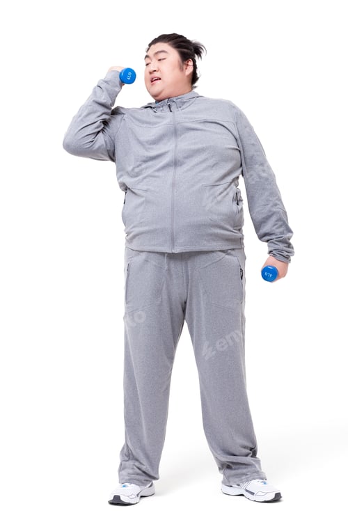 Preview: Overweight man exercising with dumbbell