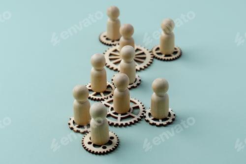 Preview: A conceptual image with wooden figures standing on interconnected gears.