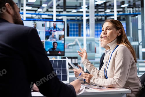 Preview: Industrial plant shareholders in videocall meeting review financial statements