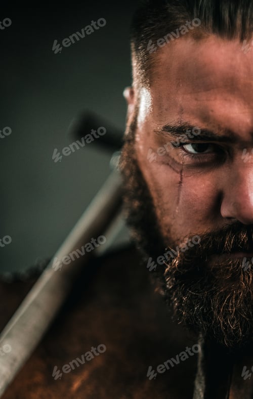 Preview: Viking with cold weapon in a traditional warrior clothes