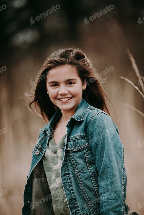 Preview: Preteen girl in the fall on a windy day