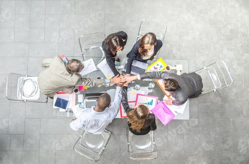 Preview: Business team stacking hands