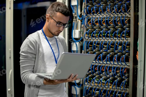 Preview: Young Engineer Managing Supercomputer Servers