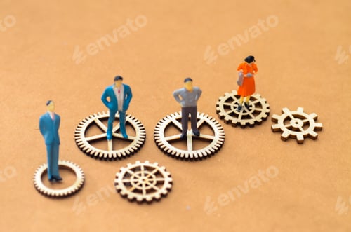Preview: Business Process Integration: Miniature Figures and Wooden Gears on Ochre Background
