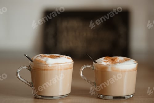 Preview: Two cups of coffee with foamed milk and cinnamon
