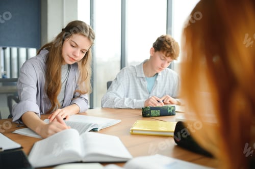 Preview: group of young college students in classroom
