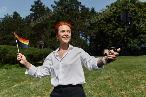 Preview: Campus Pride: A Woman Holds a Rainbow Flag and Selfies