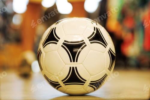 Preview: Soccer ball close-up on the floor on a multicolored background