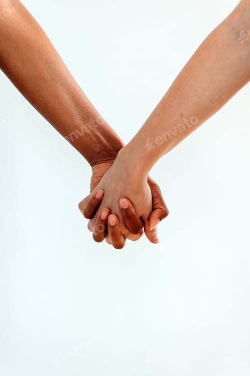 Preview: multiethnic couple female arms holding hands against white background