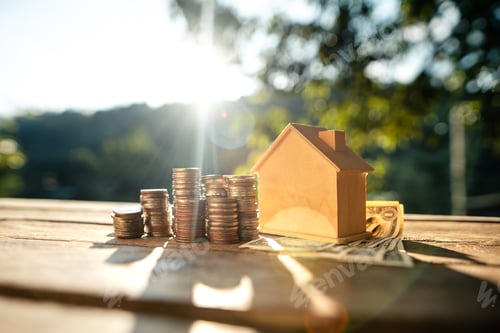 Preview: Saving money home, stacked money and savings house on the table