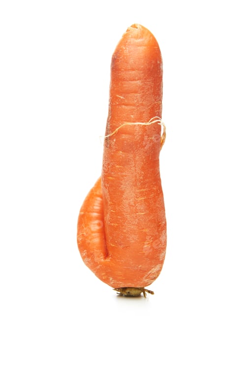 Preview: Fresh natural ugly raw carrot isolated on white background
