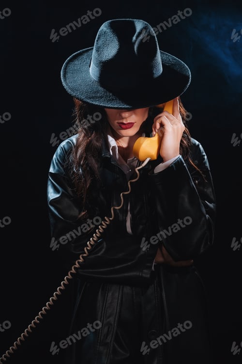 Preview: Dark noir portrait of a female detective holding a retro telephone receiver.