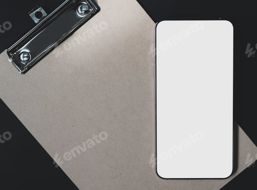Preview: Close-up shot of Mockup blank screen smartphone on brown clipboard with black background.