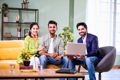 Preview: Indian family investment consultation at home with professional agent reviewing paperwork