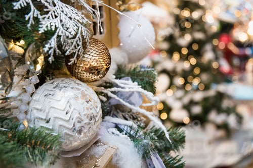 Preview: Details decorated Christmas tree with golden cone balls, garland. Outdoor fair.