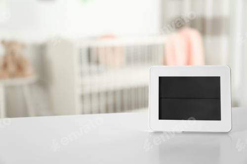 Preview: Digital temperature and humidity control in baby room interior. Space for text