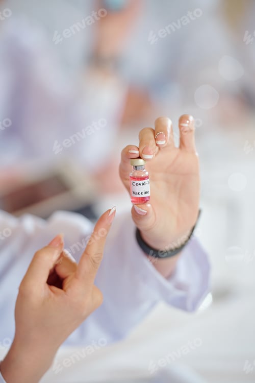 Preview: Female scientist showing vaccines