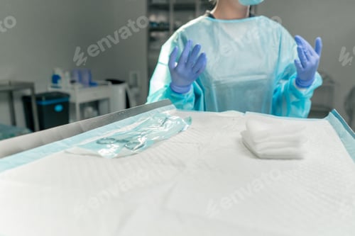 Preview: close up in a modern clinic in a bright spacious operating room, a doctor surgeon in sterile gloves