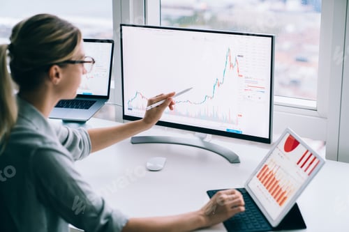 Preview: Unrecognizable economist showing graph on computer screen in office