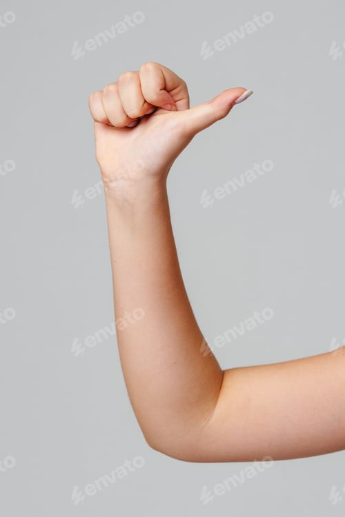 Preview: hand with a thumbs up gesture against a neutral background