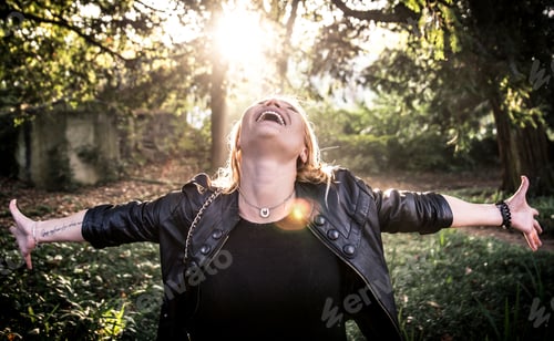 Preview: Young blonde woman enjoying time in the forest