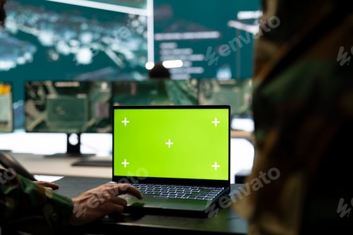 Preview: Trooper monitors chroma key mockup display on a laptop in general headquarters
