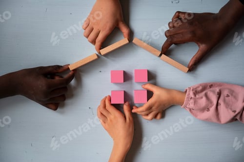 Preview: Five children making a house of wooden blocks