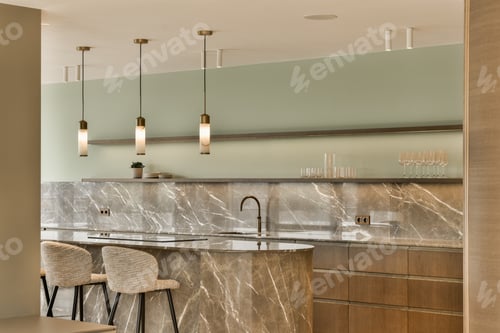 Preview: a kitchen with marble counter tops and three stools