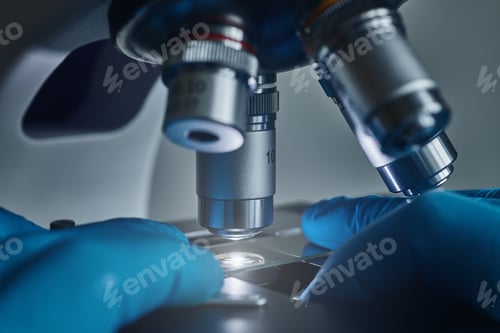 Preview: Scientist hands with microscope