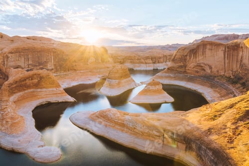 Preview: Golden sunset over a serene river canyon