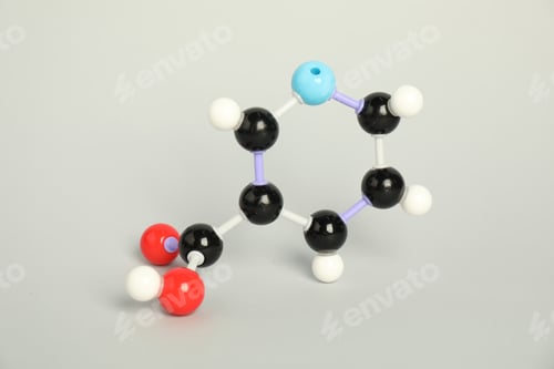 Preview: Molecule of niacin (vitamin B3) on light grey background. Chemical model
