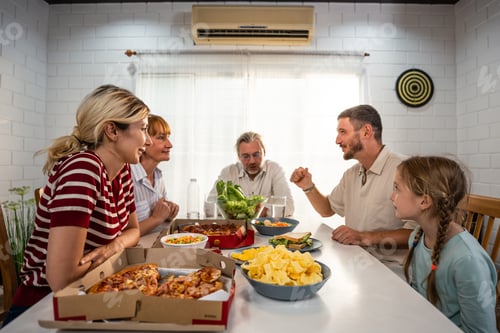 Preview: Caucasian lovely family having dinner, enjoying evening party in house.