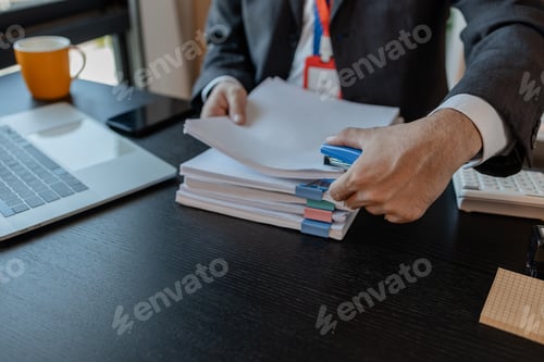 Preview: an accounting and financial officer is working on documents in the office