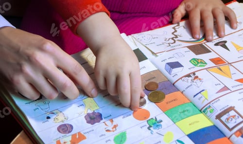 Preview: mom and child read a book and play,