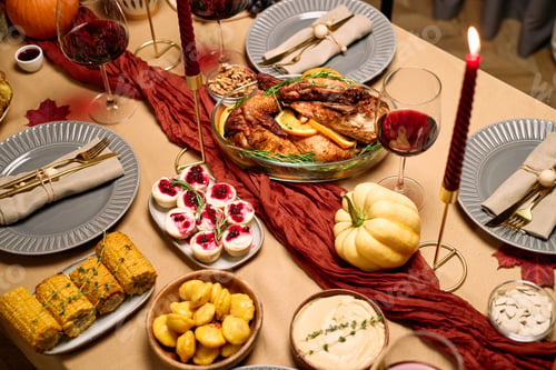 Preview: Thanksgiving Dinner Table Displaying Festive Food and Drinks for Friends