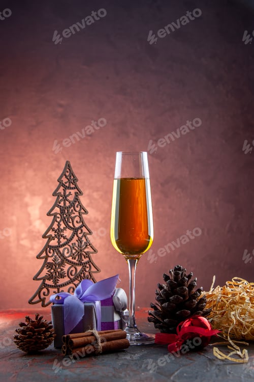 Preview: front view glass of champagne with present and toys on light background drink alcohol photo color