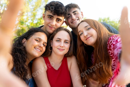 Preview: Group of young adults taking a selfie outdoors