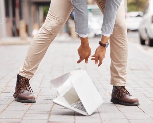 Preview: Shot of an unrecognizable businessperson dropping a laptop on the floor