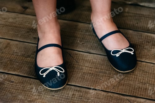 Preview: Lovely girl shoes over wooden deck floor