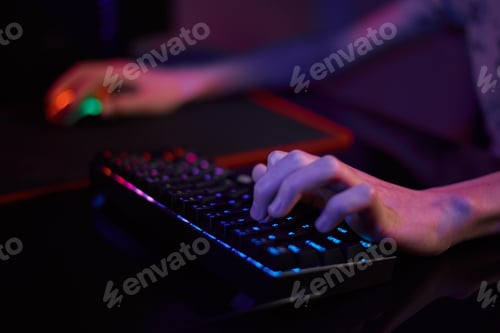 Preview: Gamer play computer game, use rgb neon colored keyboard